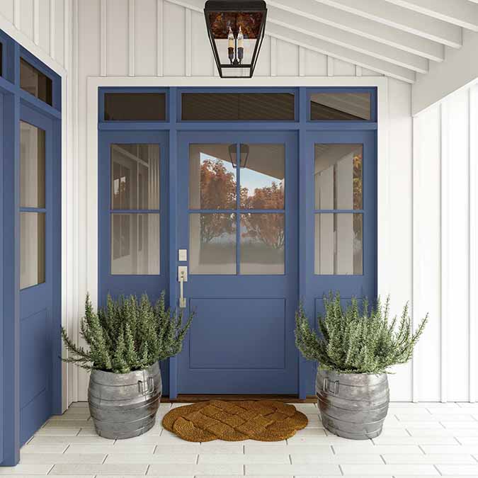 A residential home exterior in the house paint color Blue'd Up, the perfect violet blue paint color from Clare. Blue'd Up is a violet blue paint color that will sweep you off your feet, setting a sensuous mood in any space. SHOP NOW.