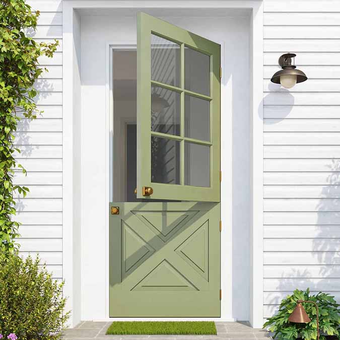 A residential home exterior in the house paint color Extra Virgin, the perfect moss green paint color from Clare. The green that goes with everything. Like the good stuff you drizzle to elevate a dish, it’s the essential ingredient that pulls a room together.