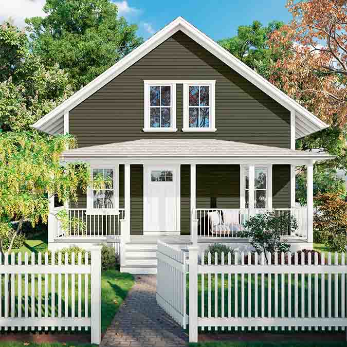 A residential home exterior in the house paint color Field Trip, the perfect forest green paint from Clare. Bring a sense of adventure to your space with this deep, forest green paint color that captures the natural beauty and intrigue of an outdoor escape.