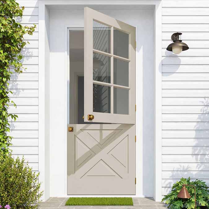 A residential home exterior in the house paint color Flatiron, the perfect taupe paint color from Clare. Flatiron is a rich, warm, neutral paint color that plays beautifully with natural light and is inspired by the namesake neighborhood in downtown NYC. Shop now.