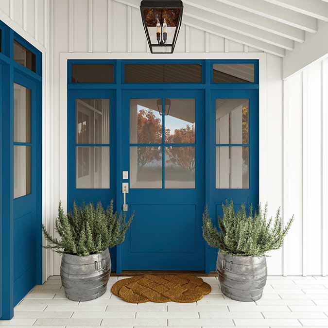 A residential home exterior in the house paint color Hyperlink, the perfect blue wall paint color from Clare. Hyperlink is a bold, royal blue wall paint color. Like the brightly underlined blue born on the internet, you you can’t help but see where it leads. Shop now.