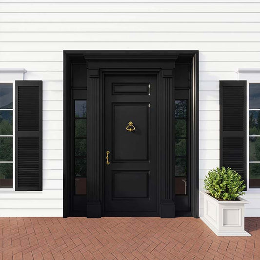 A residential home exterior in the house paint color Blackest, the perfect black paint from Clare. Blackest is a deep, dramatic black paint color with the power to make a space pop. Shop now and get premium, zero VOC paint delivered to your door.