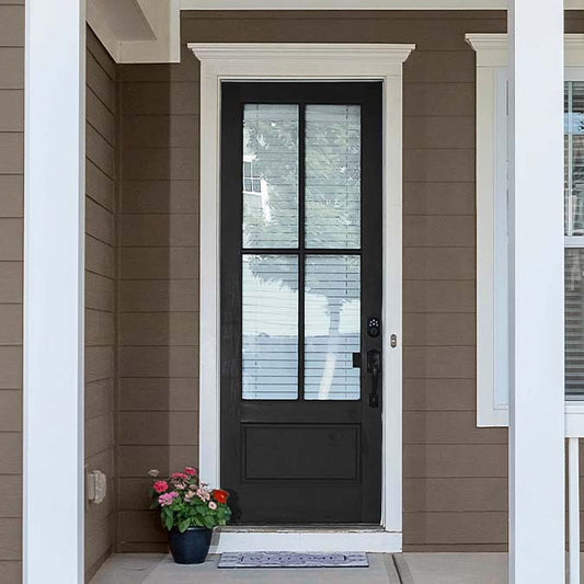 A residential home exterior in the house paint color Blackish, the perfect almost black paint color from Clare. Blackish is an almost black paint color that's less intense than true black, but bold enough to make a statement.