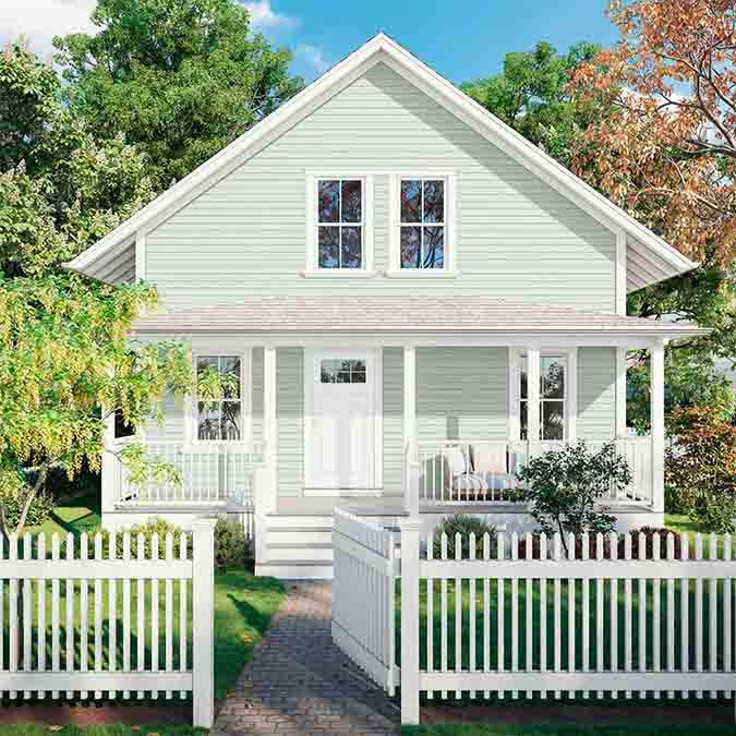 A residential home exterior in the house paint color Flow State, the perfect french blue paint from Clare. Flow State is an airy, light french blue paint color that will turn up the tranquility in any room you choose. Shop now.