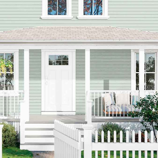 A residential home exterior in the house paint color Fresh Kicks, the perfect bright white paint color from Clare. Fresh Kicks is a clean, bright white paint color with no undertones. Fresh and modern, like your favorite white pair, straight out the box. Shop now.