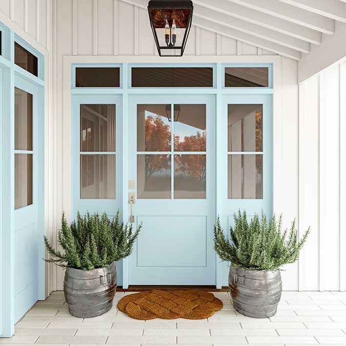 A residential home exterior in the house paint color Frozen, the perfect icy blue paint color from Clare. Frozen is an icy, cool blue paint color that’s both fresh and invigorating. This confident classic is the perfect cool light blue paint color. Shop now.