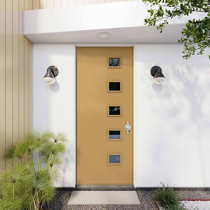 A residential home exterior in the house paint color Good as Gold, the perfect golden yellow paint shade from Clare. Good as Gold is stunning golden yellow paint shade! Cheerful yet perfectly subdued, this mellow mustard hue is worth its weight in gold!