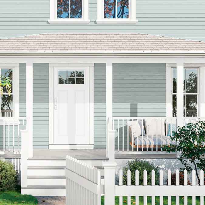 A residential home exterior in the house paint color Whipped, the perfect Warm White Paint Color from Clare. Dreamy and whisked-to-perfection, this is the warmest of our whites and a constant best-seller! Shop now.