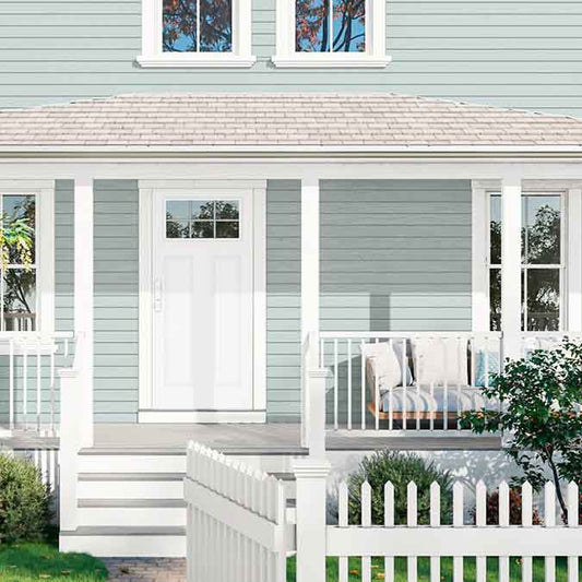 A residential home exterior in the house paint color Whipped, the perfect Warm White Paint Color from Clare. Dreamy and whisked-to-perfection, this is the warmest of our whites and a constant best-seller! Shop now.