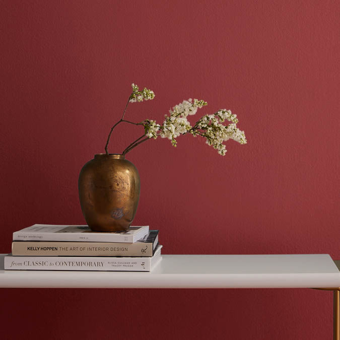 A beautiful home interior room painted in Big Apple, the perfect candy apple red paint color from Clare. Big Apple is a deliciously striking candy apple red paint color named in honor of NYC - the place where the world's best paint brand was born.