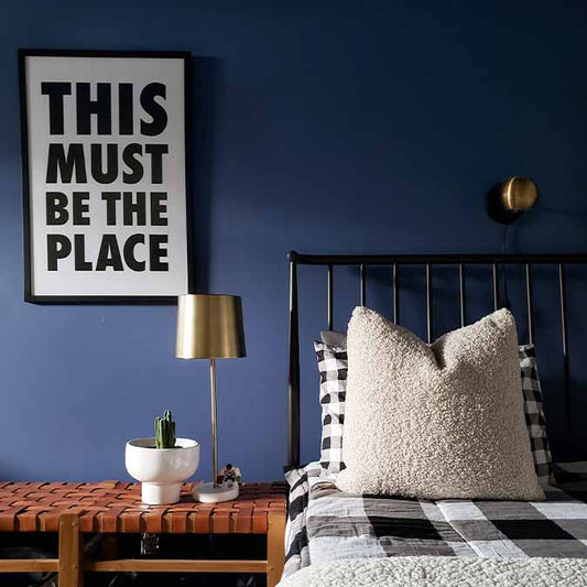 A beautiful home interior room painted in Blue'd Up, the perfect violet blue paint color from Clare. Blue'd Up is a violet blue paint color that will sweep you off your feet, setting a sensuous mood in any space. SHOP NOW.