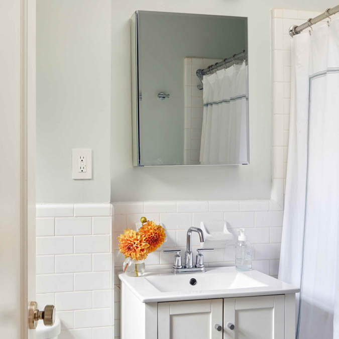 A beautiful home interior room painted in Chill, the perfect light greenish gray paint color from Clare. Chill is a light gray paint color with subtle green undertones. Light, airy, & calming, this barely there hue is an excellent antidote to a long day.  Shop now.