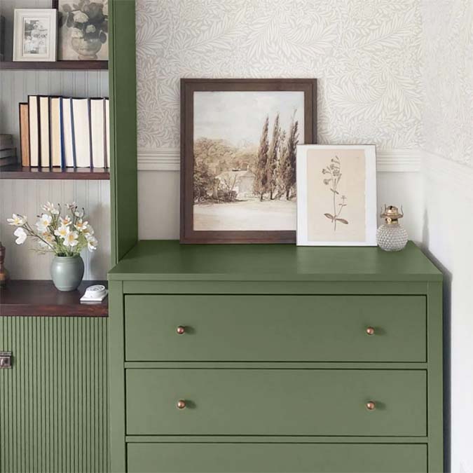 A beautiful home interior room painted in Daily Greens, the perfect hunter green paint color from Clare. Daily Greens is the perfect hunter green paint color. Get your daily fix with this mossy olive green that’s the secret to a well-balanced space.