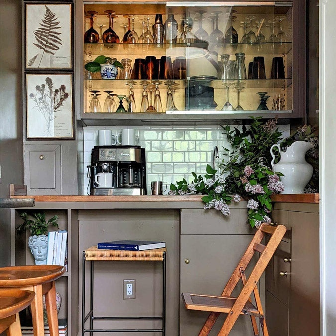 A beautiful home interior room painted in Dirty Chai, the perfect light brown paint color from Clare. Dirty Chai is a warm, nutty light brown paint color that's the perfect pick-me-up. Just like a warm, cinnamon-y spiced chai with a shot of espresso. Shop now.