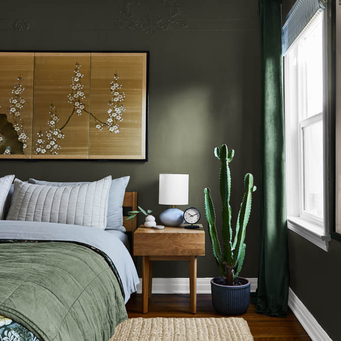 A beautiful home interior room painted in Field Trip, the perfect forest green paint from Clare. Bring a sense of adventure to your space with this deep, forest green paint color that captures the natural beauty and intrigue of an outdoor escape.