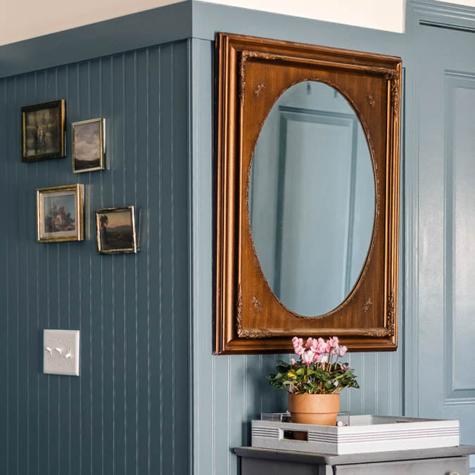 A beautiful home interior room painted in Good Jeans, the perfect denim blue paint color from Clare. Good Jeans is a sophisticated blue paint color with a hint of gray undertones. Just as perfect as your favorite pair of broken-in denim. Shop now.