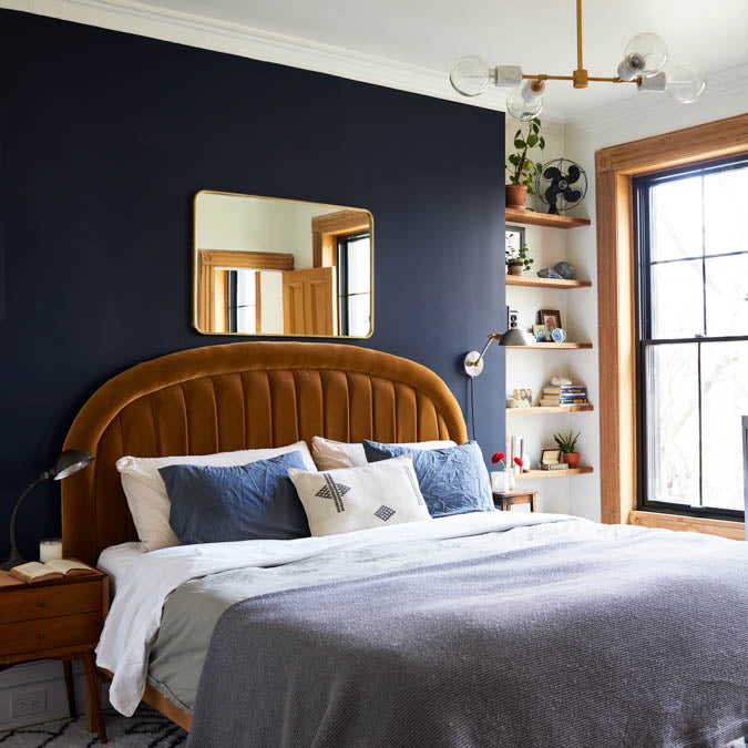 A beautiful home interior room painted in Goodnight Moon, the perfect midnight blue paint color from Clare. Goodnight Moon is a deep, midnight blue paint color This strong midnight blue hue is dark and alluring like an infinite, moonlit sky.  Shop now.