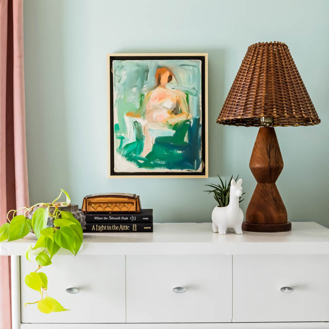A beautiful home interior room painted in Headspace, the perfect blue green paint color from Clare. Headspace is a soft, blue-green paint color that brings a calm, airy feel to any room. This popular shade of blue is a best-seller and fan- favorite! Shop now.