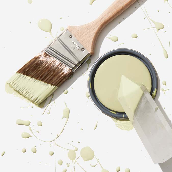 A beautiful home interior room painted in High Vibe, the perfect green honeydew paint color from Clare. High Vibe is a luminous, light green paint glows with good energy and is the perfect choice to bring any space back into balance.