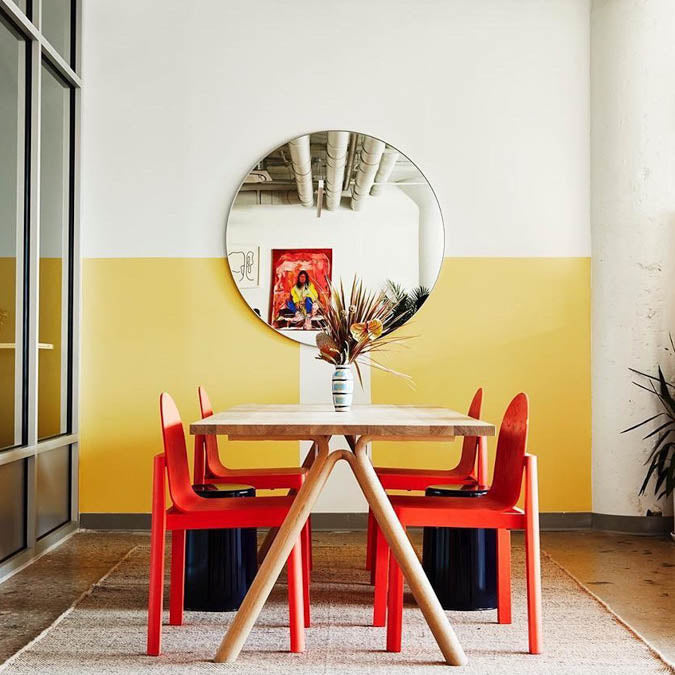 A beautiful home interior room painted in Lemonade, the perfect yellow wall paint from Clare. Lemonade is a refreshing lemony yellow paint color inspired by the favorite summer drink.  Shop now.