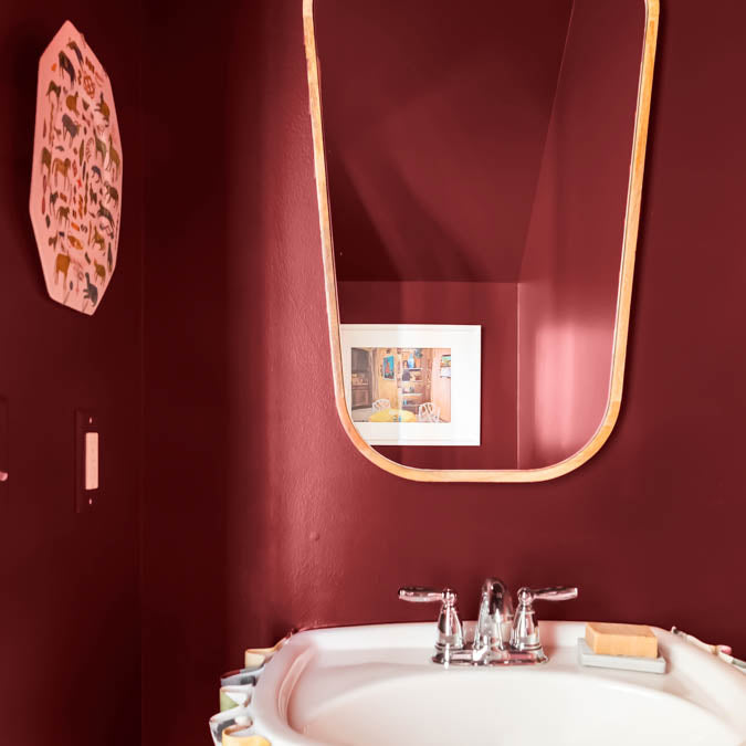 A beautiful home interior room painted in Vintage, the perfect burgundy paint from Clare. Another glass, please! Consider this bold burgundy paint, the color equivalent of a heavy pour from your favorite bottle of red—rich, enveloping and a total treat for the senses.