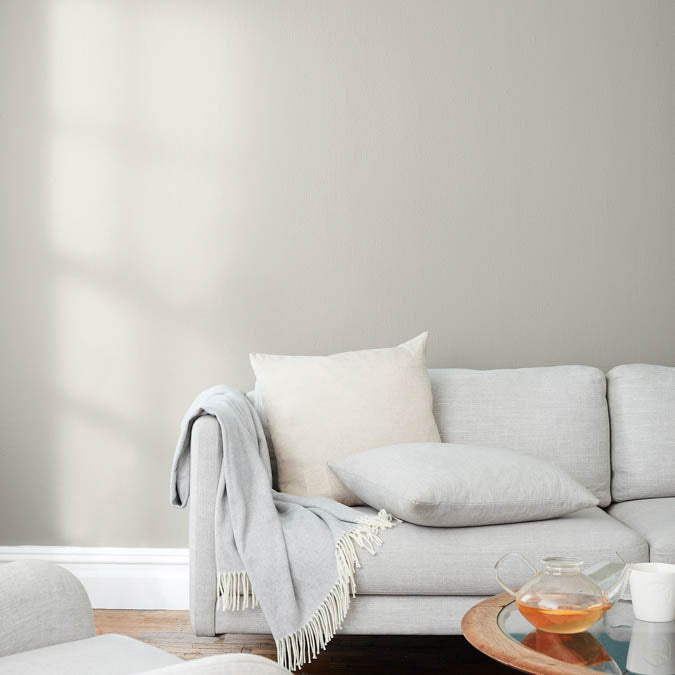 A beautiful home interior room painted in Windy City, the perfect warm gray paint color from Clare. Windy City is a light greige paint color that's beautiful and breezy, just like its namesake! This warm hue looks great in any space.  Shop now.